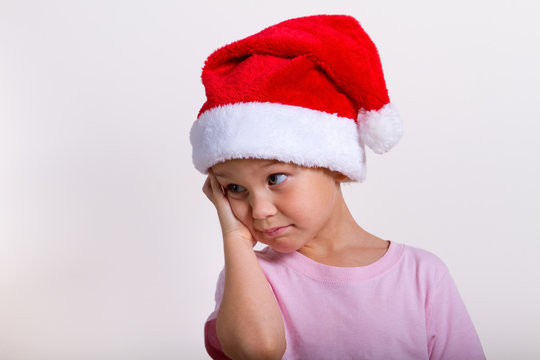 Cute little girl in the santa claus hat