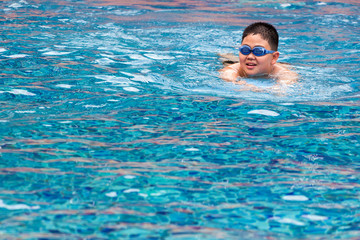 mom and son enjoying swimming in pool