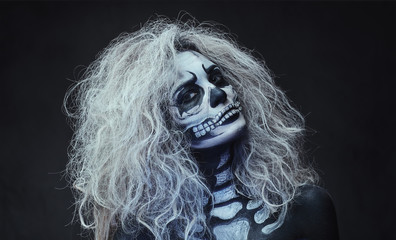 Halloween female skull makeup.