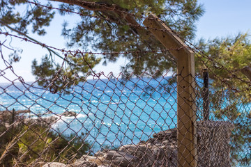 Beautiful and Blur Blue Sea View back of fence.