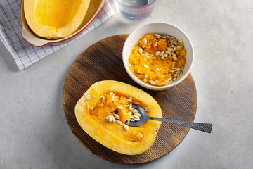 Cut spaghetti squash on wooden board