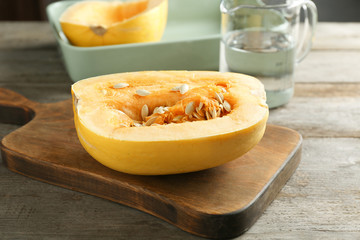 Cut spaghetti squash on wooden board