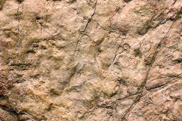 Rock texture and surface background. Cracked and weathered natural stone background.