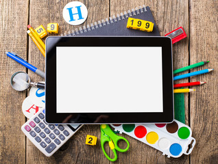 Composite image of digital tablet on students desk showing back to school message