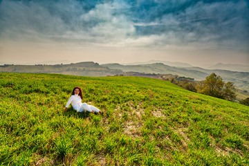 Fototapeta na wymiar menopausal woman on green hill