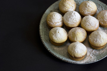 Tasty vanilla muffins on an ornamented plate