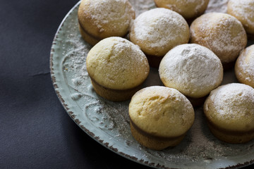Fototapeta na wymiar Tasty vanilla muffins on an ornamented plate