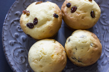 Tasty vanilla muffins on an ornamented plate
