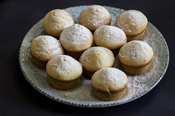 Tasty vanilla muffins on an ornamented plate