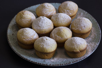 Tasty vanilla muffins on an ornamented plate