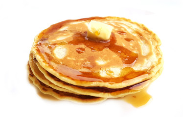 Homemade pancakes with butter and maple syrup