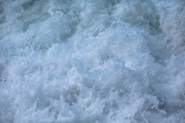 Fototapeta na wymiar foaming water of the sea