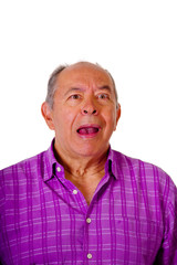 Obraz premium Portrait of a happy mature man, with his mouth open and wearing a purple square t-shirt in a white background