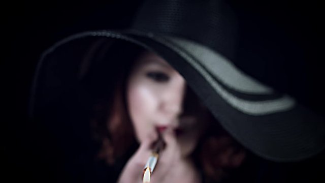 4k Gagster Woman Lighting Up Cigarette in Mouthpiece