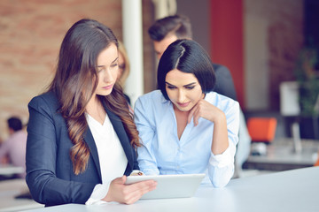 Teamwork process concept.Young coworkers work with new startup project in office.Analyze document, plans.