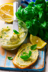 Butter with a basil and a lemon for sandwiches