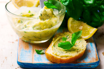 Butter with a basil and a lemon for sandwiches