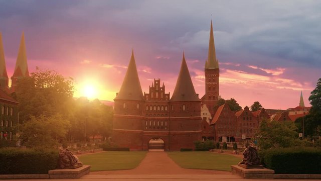 Holsten Gate and statues of lions at sunrise, Luebeck, Germany