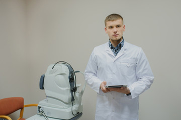 portrait of young beautiful doctor/eye specialist/optometrist in an ophthalmologic clinic © Med Photo Studio