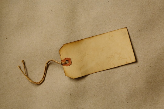 Old stained paper tag with blank space