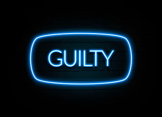 Guilty  - colorful Neon Sign on brickwall