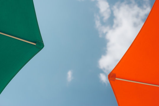 Two Colourful Sunshade Umbrellas