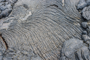 Pahoehoe or rope lava, on Rabida Island, Galapagos. It is formed of igneous rock, which create bizarre patterns as it cools known as lava sculpture.