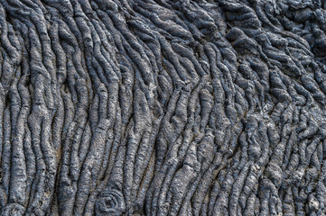 Pahoehoe or rope lava, on Rabida Island, Galapagos. It is formed of igneous rock, which create bizarre patterns as it cools known as lava sculpture.