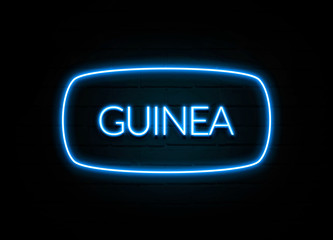 Guinea  - colorful Neon Sign on brickwall