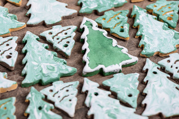 christmas tree cookies on a wooden background