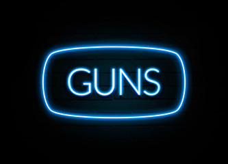 Guns  - colorful Neon Sign on brickwall