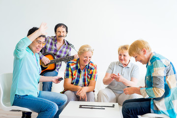 Senior people playing board games