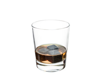 A full glass with whiskey stones. Isolated.