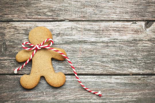 Gingerbread man on a wooden background