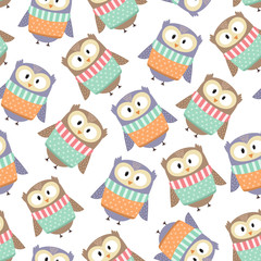 Cute owls in the winter clothes seamless pattern. Vector illustration