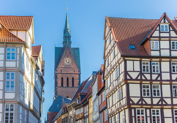 Fototapeta premium Half-timbered houses and church tower in Hannover