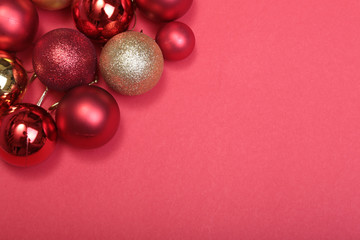 Red christmas balls on a red background
