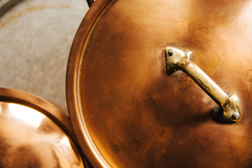 Copper pots with lids on from above