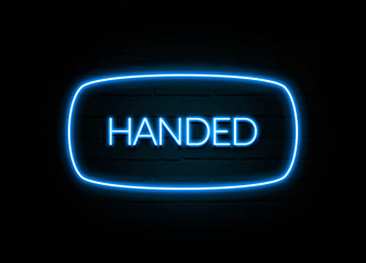Handed  - colorful Neon Sign on brickwall