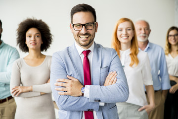 Young business people with senior colleague