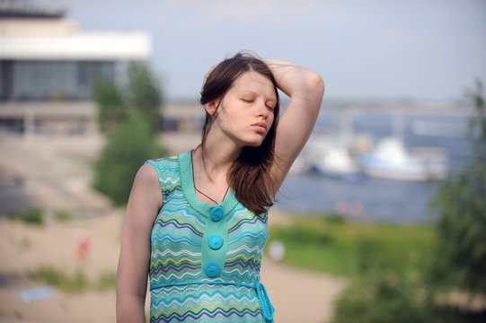 Pretty woman from Volgograd on the shore of the great Russian river Volga inflates her lips and shows her beautiful hair
