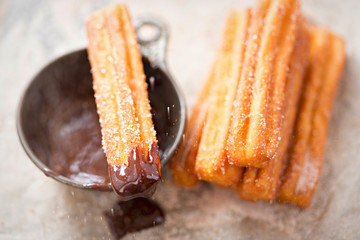 Churros with sugar and chocolate sauce 