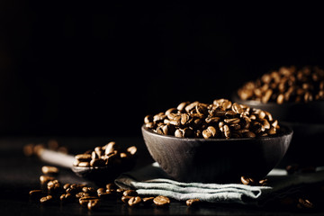 Fototapeta na wymiar Closeup of coffee beans in bowl