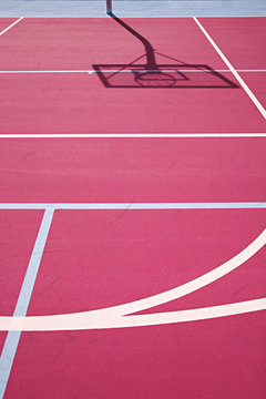 graphic colourful lines on a pink basketball court