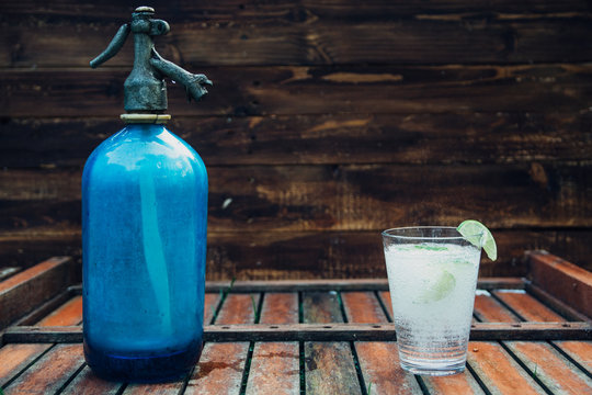 Old Seltzer water aerator bottle and lemonade glass