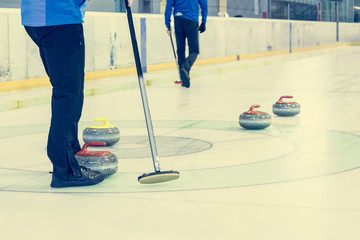 Playing a game of curling.
