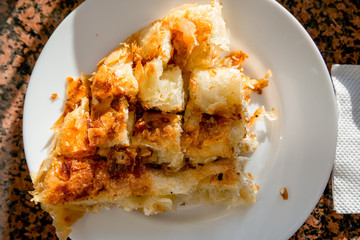 Balkan Breakfast Serving of Byrek me Gjizë (Cheese PIe with Feta & Flaky Filo Pastry) in the Sun
