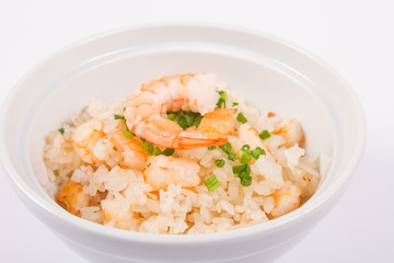 Plate of rice with shrimps on white plate. isolate, close up