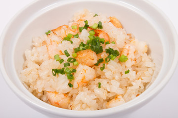 Plate of rice with shrimps on white plate. isolate, close up
