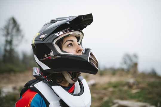 Young Woman Portrait With Motocross Helmet